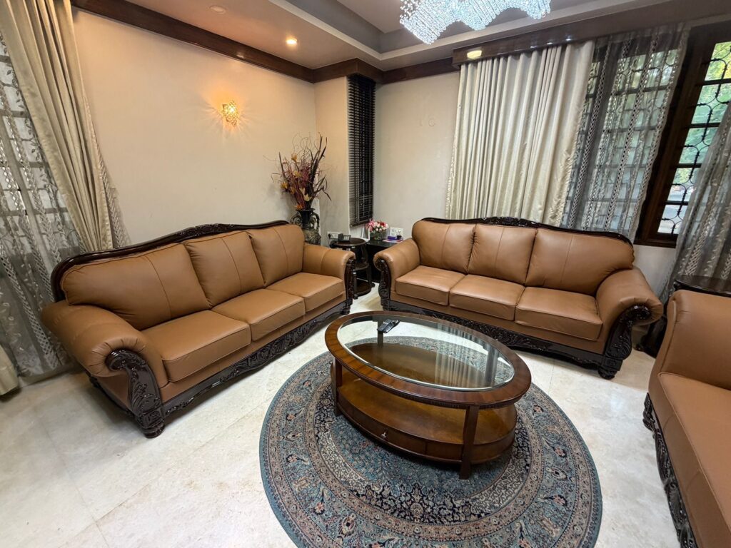 Custom-made pure leather sofa set with premium finish crafted by Shanthi Sofa Works in Bangalore